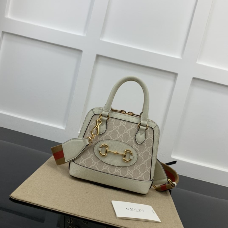 G*u*i top handle bags